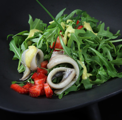 Marinated anchovies with strawberries and rocket salad